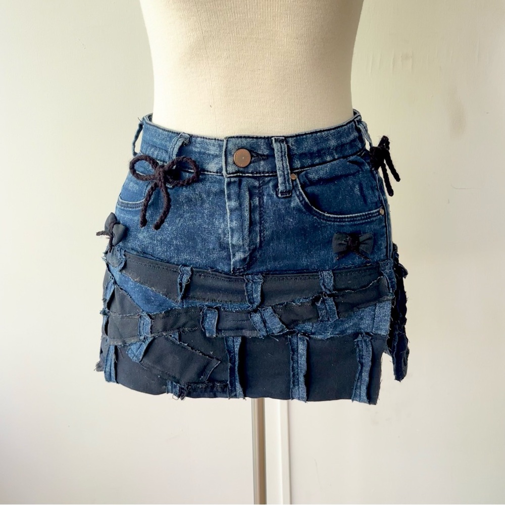 Distressed denim mini skirt